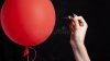 burst-red-balloon-needle-danger-concept-160916219.jpg